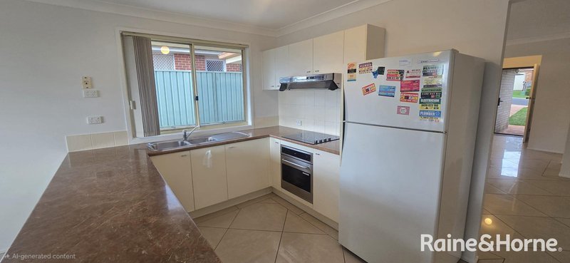 Photo - 13 Norman Dunlop Crescent, Minto NSW 2566 - Image 4
