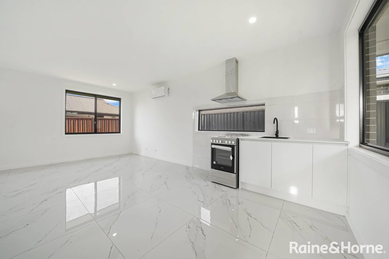 Photo - 77 Northampton Drive, Glenfield NSW 2167 - Image 9